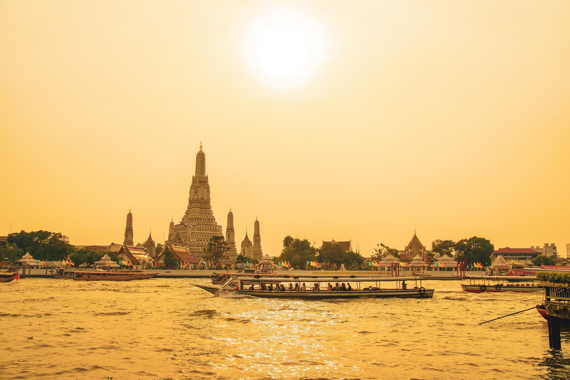 People walking on bridge over body of water during daytime