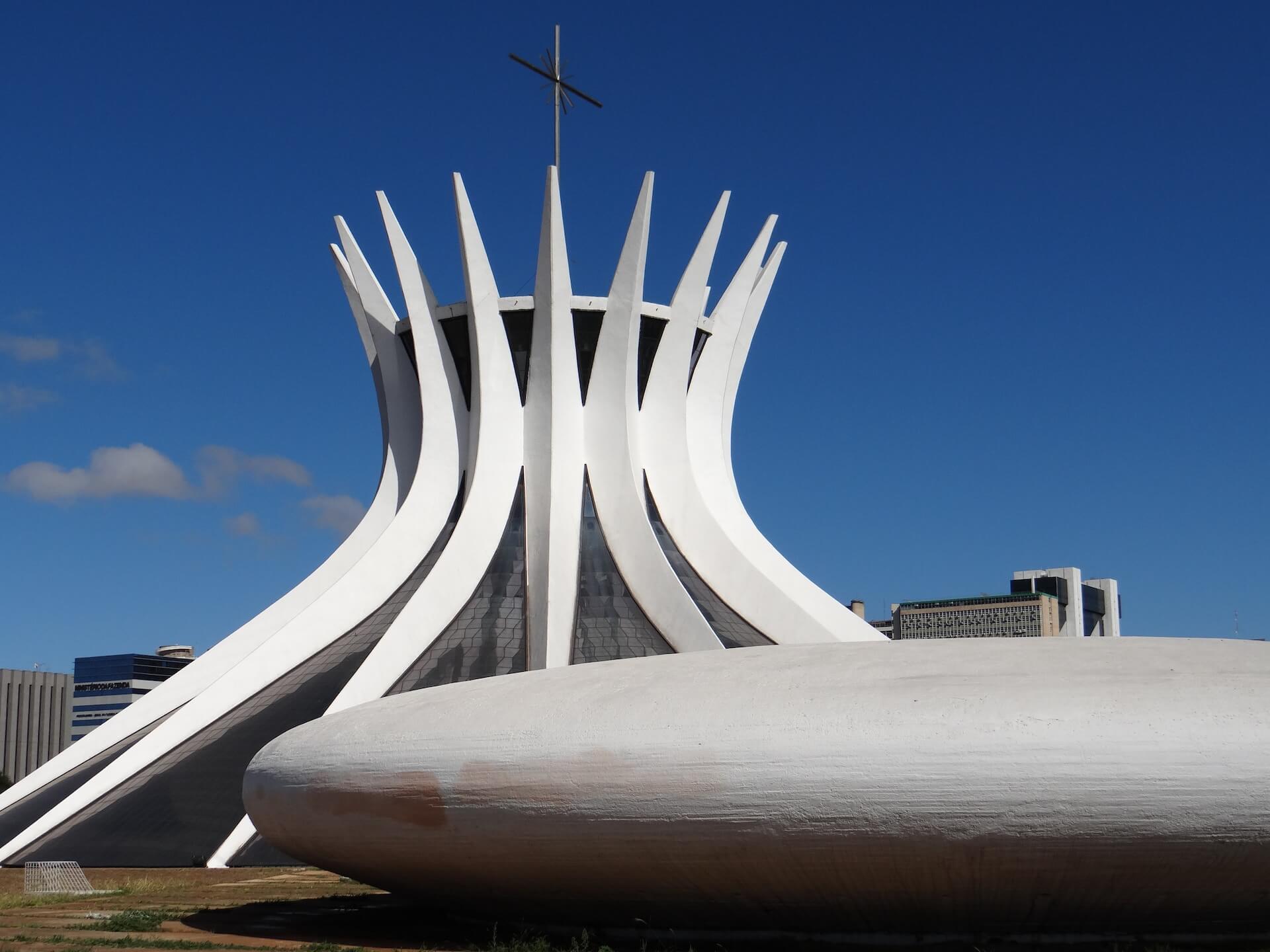 A large white building with a cross on top of it