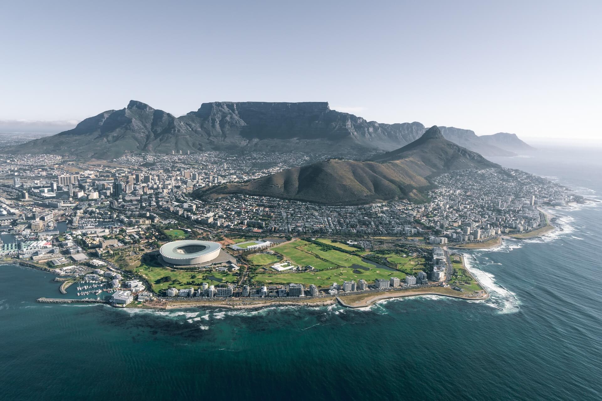 Aerial view of city near mountain during daytime